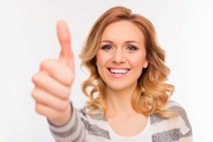 Woman Smiling Thumbs Up