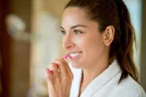 Woman Brushing Teeth