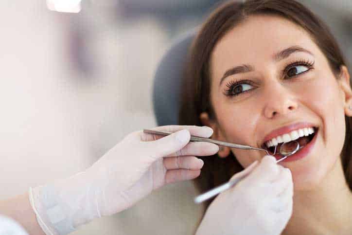 Woman smiling in dental chair.