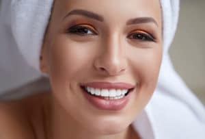 Model Girl with perfect smile after seeing Dentist for Lumineers near Rochester MI