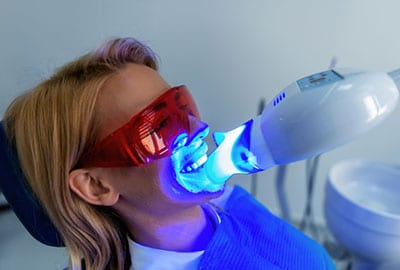 Woman Getting Zoom Teeth Whitening in Michigan