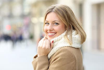 Woman Smiling After Getting Dental Veneers near Metro Detroit
