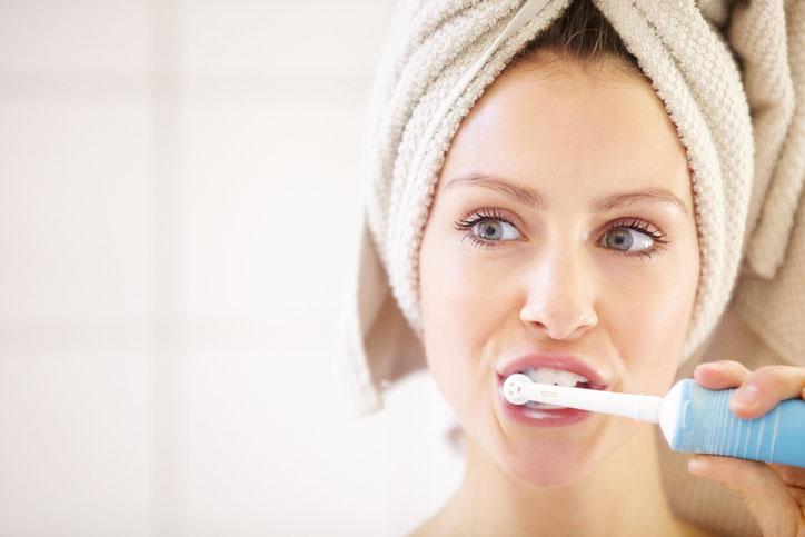 Woman Brushing her teeth