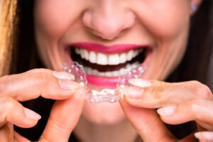 Woman Holding Clear Braces