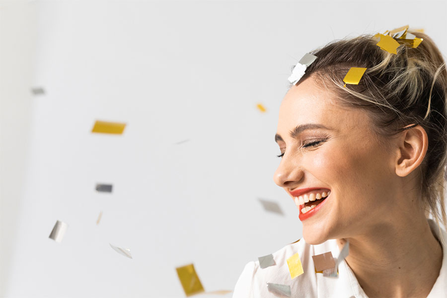 Woman Smiling with Confetti