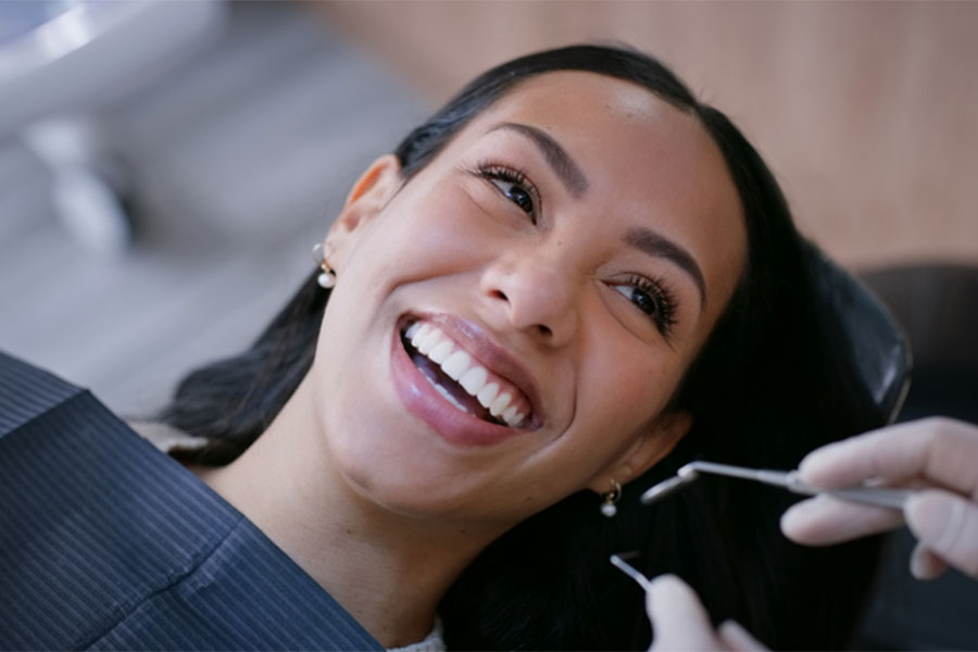 Woman Smiling in Dental Chair