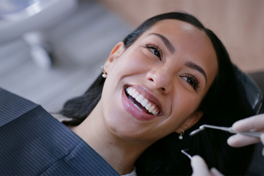 Woman Smiling at Dentist