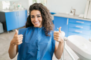 Woman Thumbs Up Dentist Chair