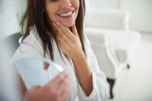 Woman holding jaw