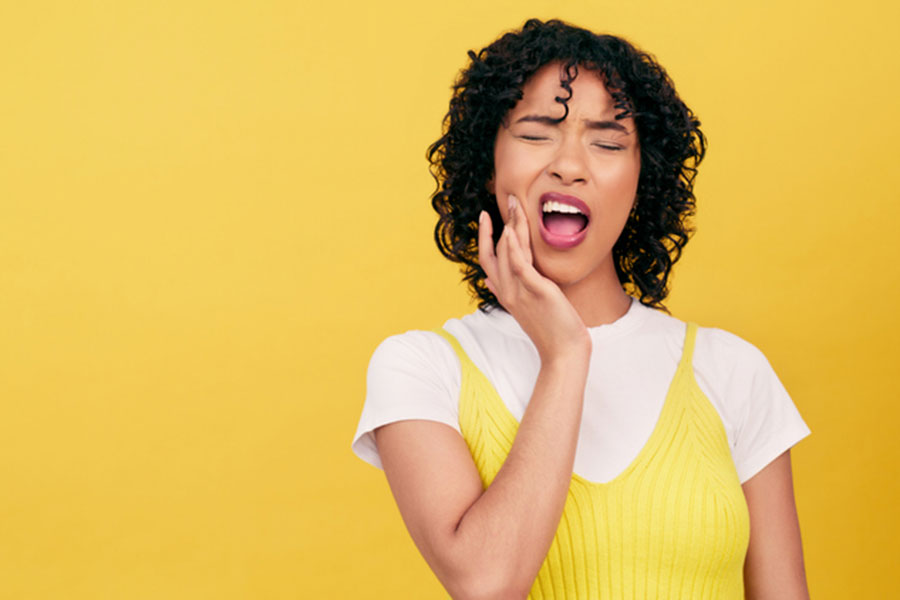 Woman Holding Mouth