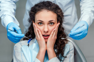 Shocked Woman in Dental Chair