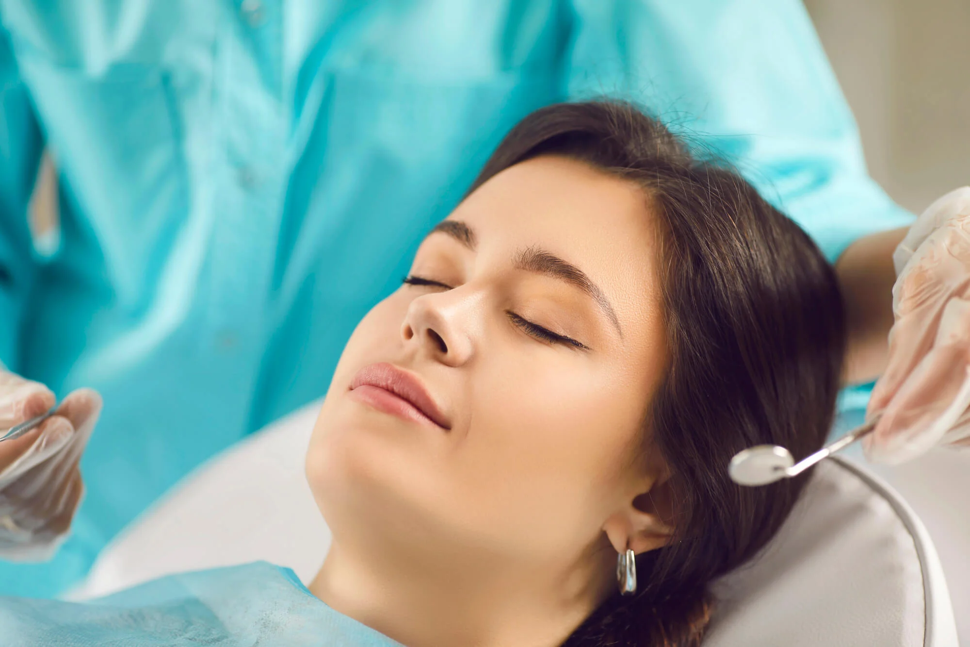 Patient relaxed during treatment with a dentist Birmingham, MI.
