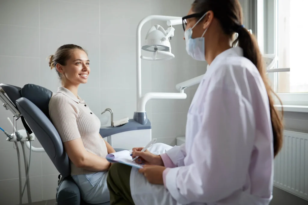Female patient smiling at a cosmetic dentist Birmingham, MI