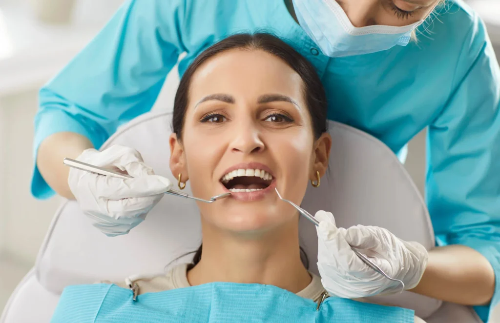 Patient and cosmetic dentist Birmingham, MI after veneers procedure.