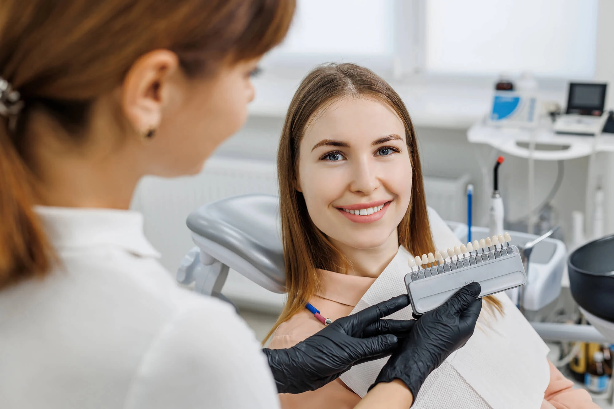Dentist Matching Tooth Shade for Porcelain Veneers in MI