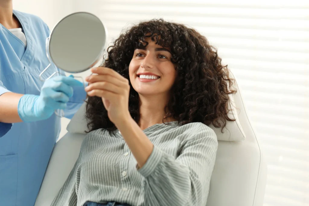 Patient Viewing Porcelain Veneers in MI Results