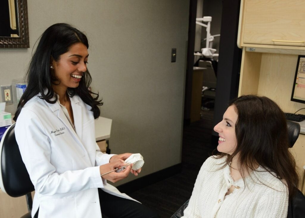 Cosmetic dentist consulting with a patient in Birmingham, MI
