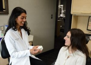 Cosmetic dentist consulting with a patient in Birmingham, MI