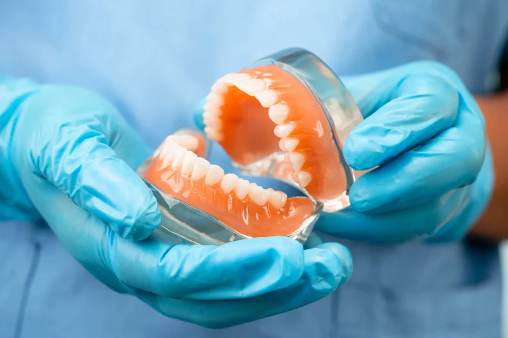 Patient receiving dentures treatment from a dentist in Birmingham MI