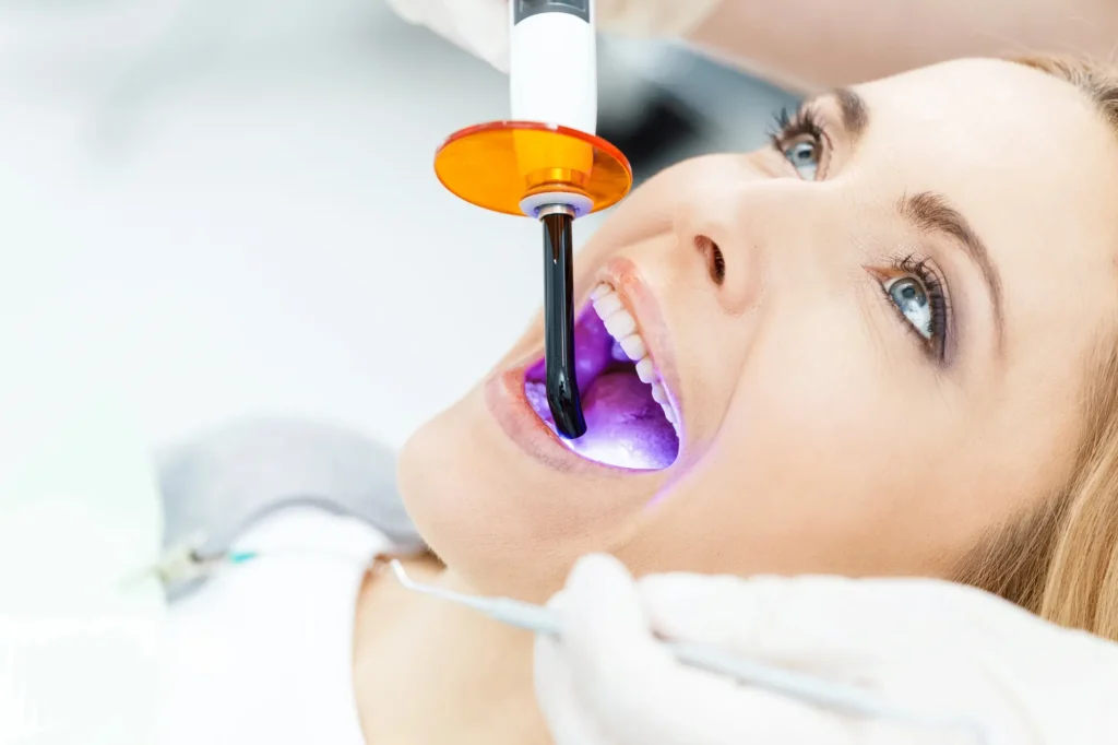 Patient whitening teeth with a dentist in Royal Oak MI